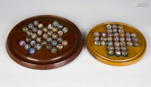 A collection of sixty-four Victorian and later glass marbles...