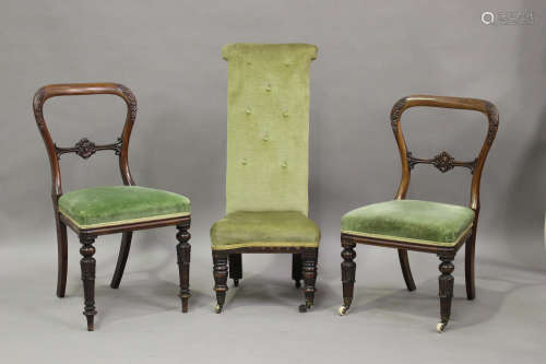 A pair of William IV mahogany dining chairs with carved deco...