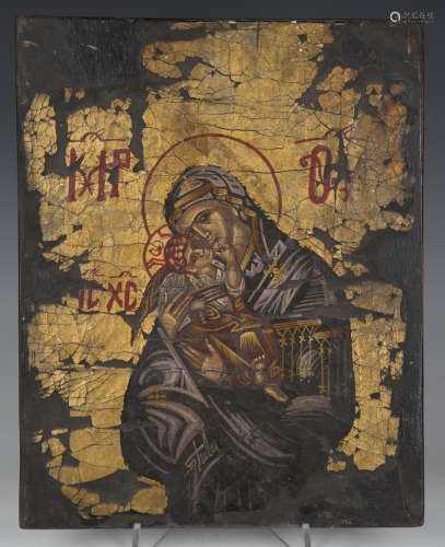 An early 20th Greek School gilded and painted icon, signed '...