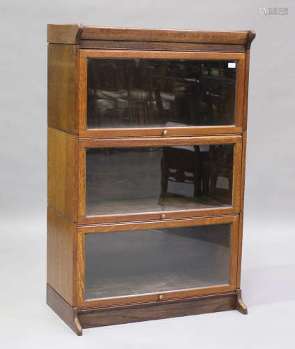 An early 20th century Globe Wernicke style oak three-section...