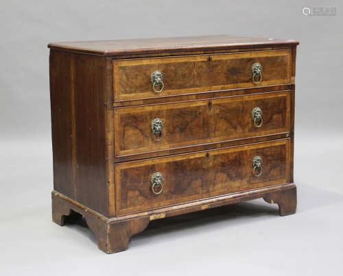 An 18th century oak and walnut chest of three drawers with c...