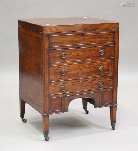 A George III mahogany dressing table, the double hinged top ...
