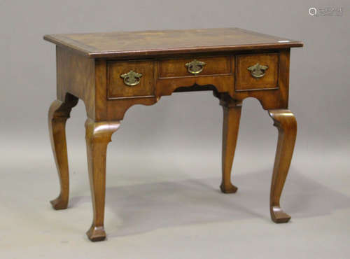 A 20th century George I style walnut lowboy with herringbone...