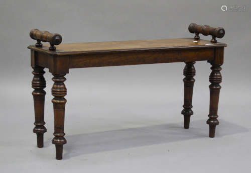 A late Victorian walnut window seat with ring turned handles...