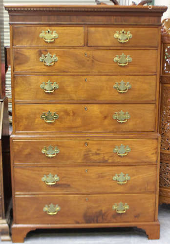 A George III figured mahogany chest-on-chest, fitted with tw...