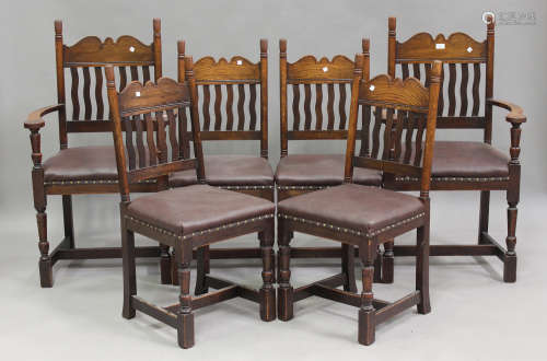 A set of six mid-20th century Arts and Crafts style oak dini...