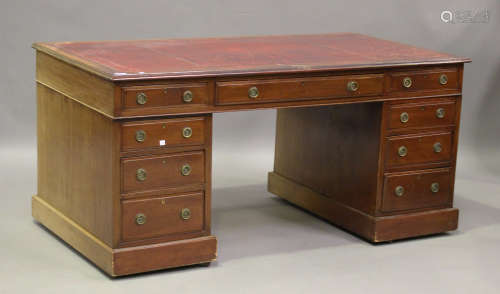 A Victorian mahogany twin pedestal desk, the top inset with ...