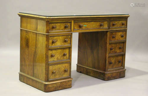 A Victorian burr walnut twin pedestal dressing table, fitted...