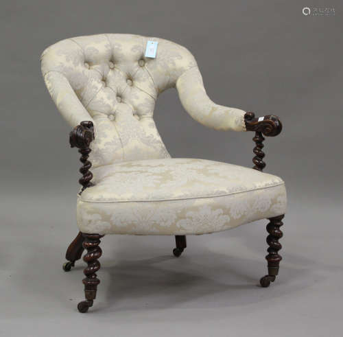 A 19th century mahogany framed scroll armchair, upholstered ...