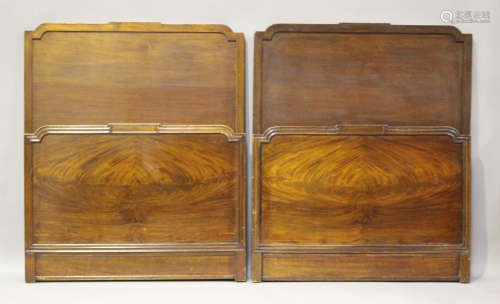 A pair of mid-20th century Heals mahogany single bed frames ...