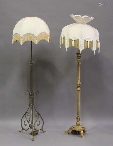 An early 20th century brass lamp standard and a giltwood lam...