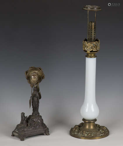 A 19th century pressed brass and opaline glass table lamp, h...