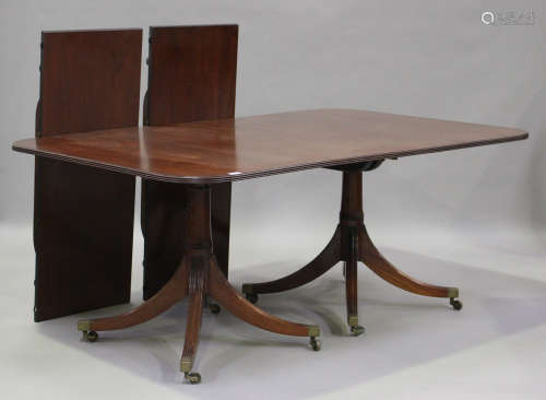 A 20th century reproduction mahogany 'D'-end dining table wi...