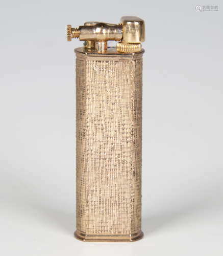 A silver cased Dunhill lighter with engine turned decoration...