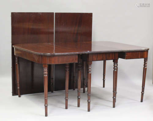 A George III mahogany dining table with central additional s...