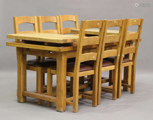 A modern oak refectory table with two extra end leaves, heig...
