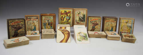 A group of eight wooden cased playing card games, including ...