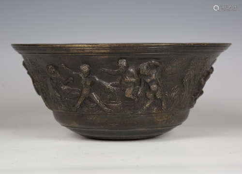 A German brown patinated bronze bowl, decorated with a conti...