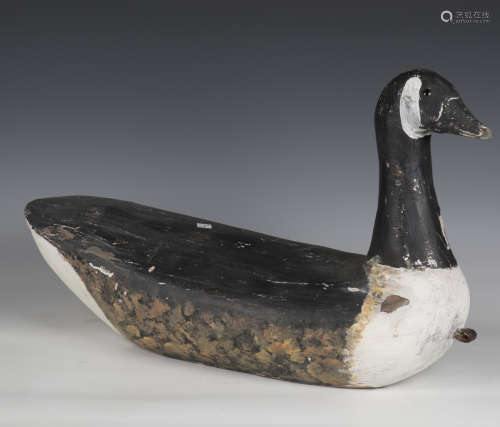 An early 20th century carved softwood decoy model of a Canad...