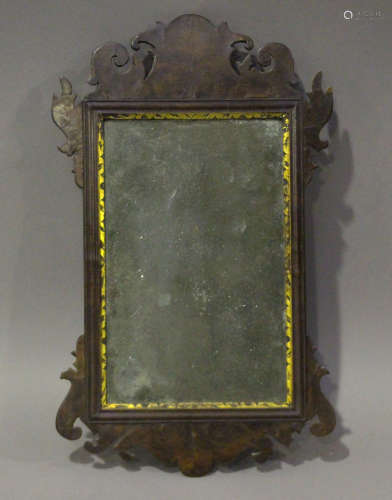 A George III mahogany fretwork wall mirror with inner gilt s...