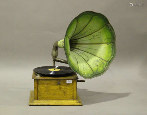 An early 20th century oak cased table-top gramophone, fitted...