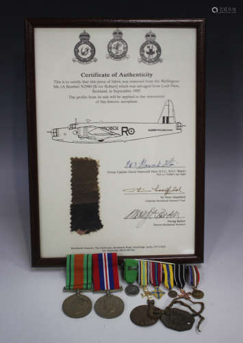 A 1939-45 Defence Medal and a War Medal, mounted on a bar, t...