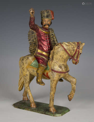 A 19th century Continental carved and painted wooden figure ...