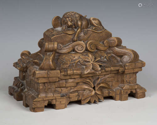 An early 20th century Swiss Black Forest carved walnut box, ...