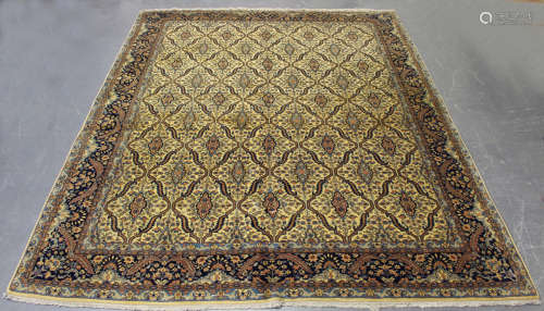 An Indian carpet, mid/late 20th century, the ivory field wit...