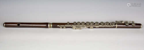 A late 19th century rosewood flute with nickel keywork, case...