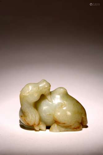 A CHINESE CELADON JADE CARVED FIGURE OF CAMEL