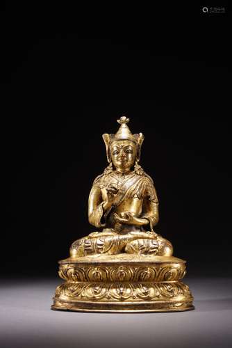 A TIBETAN GILT COPPER FIGURE OF PADMASAMBHAVA