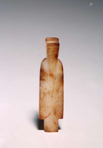 A CHINESE ARCHAIC JADE FIGURE OF AN OFFICIAL