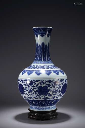 A CHINESE BLUE AND WHITE 'FLOWERS' BOTTLE VASE
