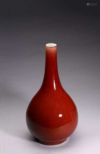 A CHINESE COPPER RED GLAZED BOTTLE VASE