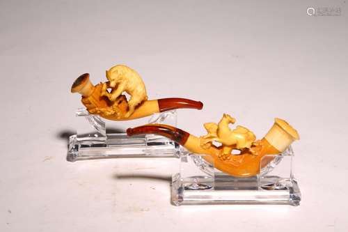 A PAIR OF ANTIQUE BONE CARVED TOBACCO PIPES