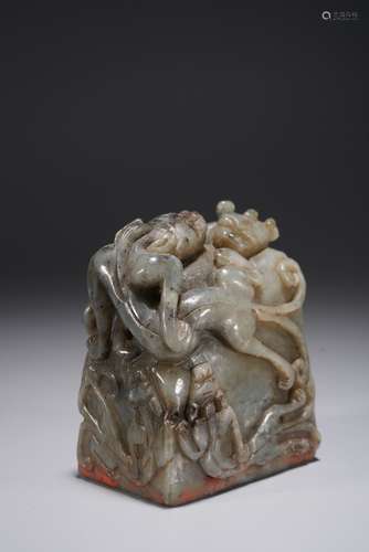 A CHINESE BLACK AND WHITE JADE SEAL