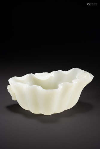 A CHINESE WHITE JADE 'LOTUS LEAF' WASHER