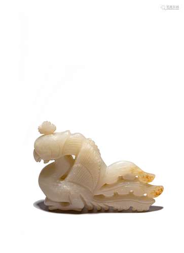 A CHINESE CELADON JADE CARVED PHOENIX