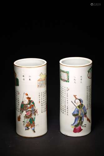 A PAIR OF CHINESE FAMILLE ROSE FIGURES CYLINDRICAL VASES