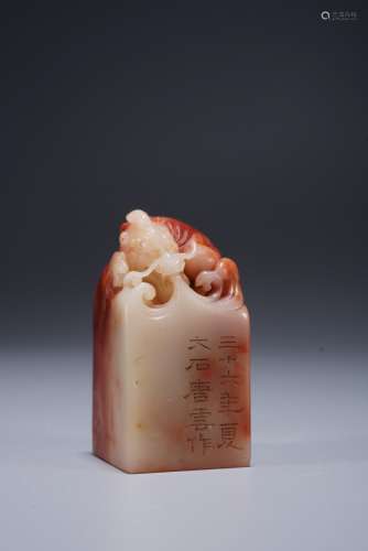 A CHINESE RED AND WHITE SOAPSTONE DRAGON SEAL