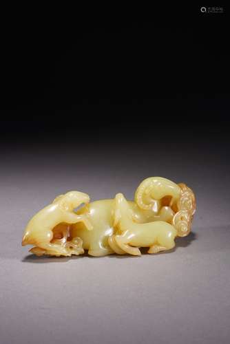 A CHINESE YELLOW JADE 'THREE RAMS' CARVING