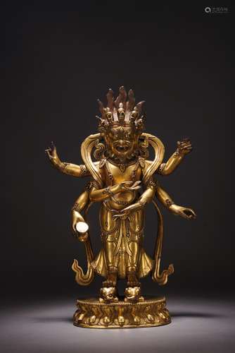 A GILT BRONZE FIGURE OF STANDING MAHAKALA