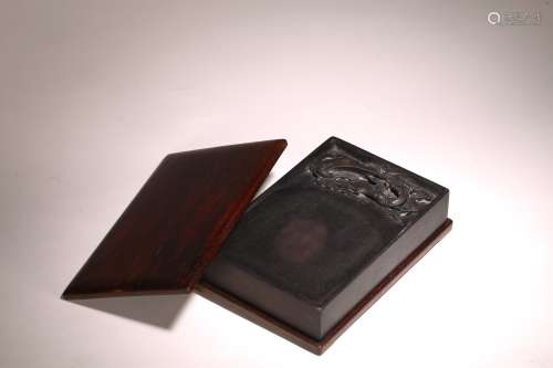 A CHINESE DUAN 'DRAGON' INKSTONE WITH ROSEWOOD COVER