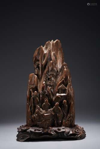 A CHINESE AGARWOOD CARVED 'FIGURES' BOULDER