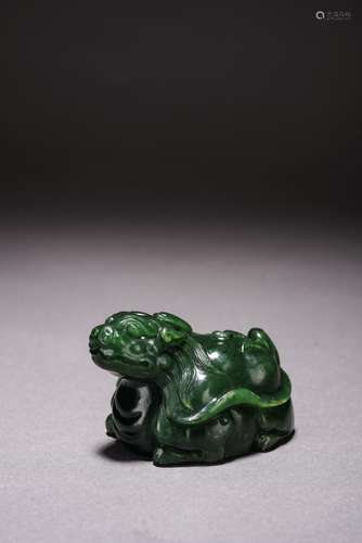 A CHINESE GREEN JADE CARVED BEAST PAPERWEIGHT