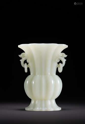 A CHINESE WHITE JADE CARVED FLUTED VASE