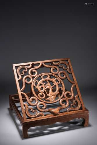 A CHINESE HUALI WOOD CARVED FOLDING MIRROR STAND