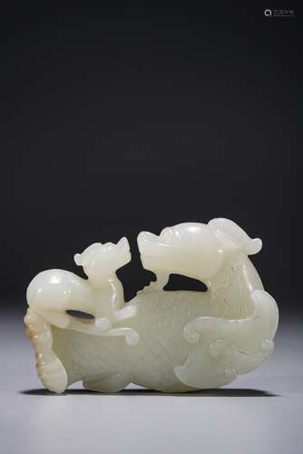 A CHINESE WHITE JADE CARVING OF DRAGONS