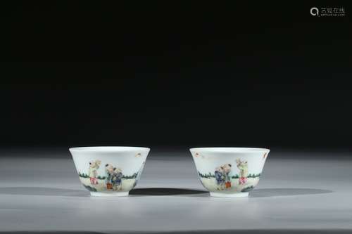 A CHINESE PAIR OF FAMILLE ROSE 'BOYS' CUPS